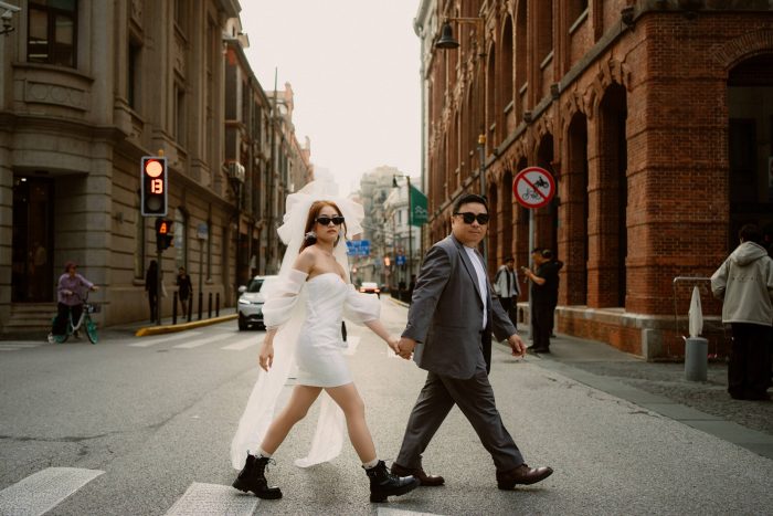 couple walking across city street