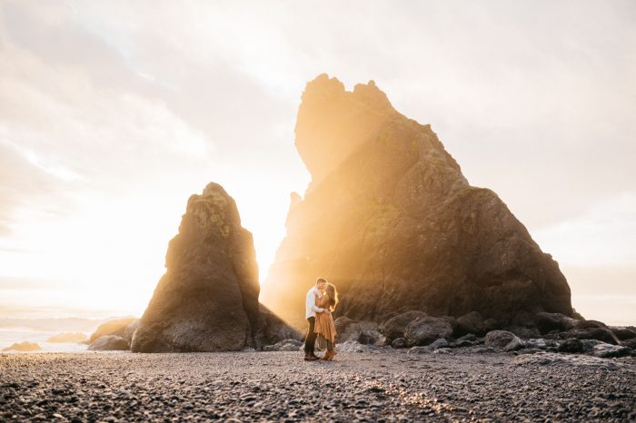 engagement photo sunset behind rock